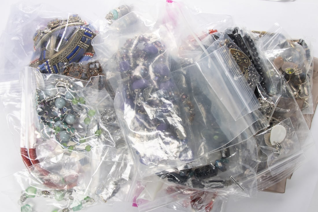 An assortment of beaded jewelry: An assortment of beaded jewelry Featuring a collection of beaded jewelry of varying styles and designs; SOLD AS IS