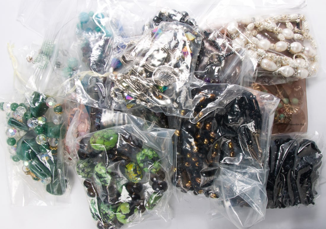 An assortment of beaded jewelry: An assortment of beaded jewelry Featuring a collection of beaded jewelry of varying styles and designs; SOLD AS IS