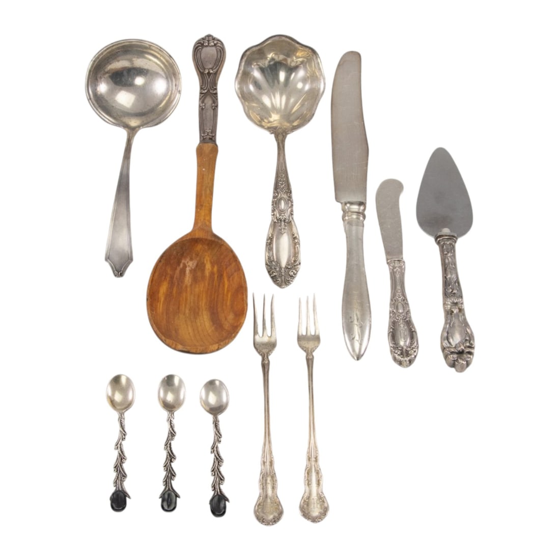 A group of sterling flatware: A group of sterling flatware, comprising: 1 gravy ladle, International, Minuet; 2 cocktail forks, Wallace, Irving, monogrammed M; butter spreader, Towle, King Richard, monogrammed: D; gravy ladle,