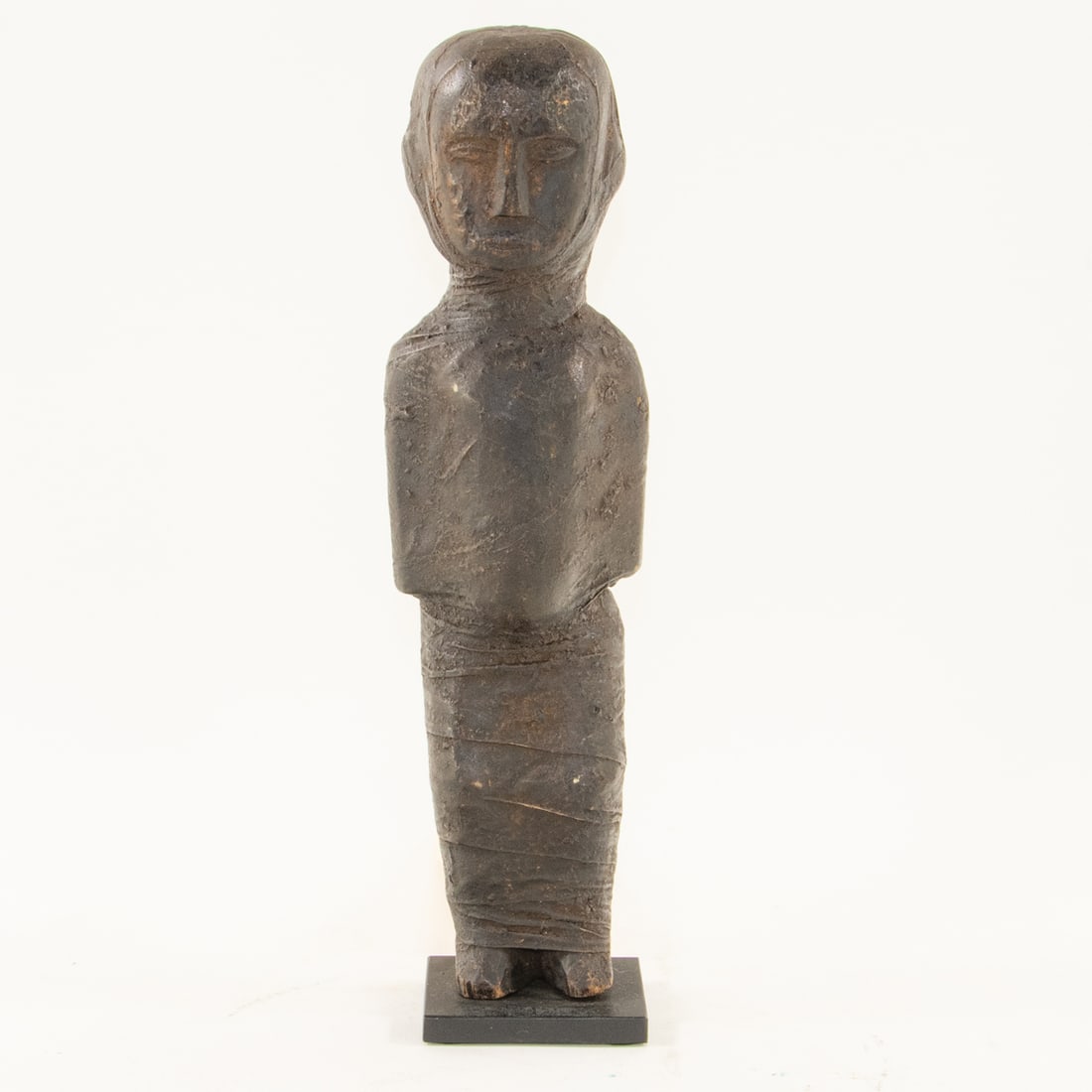 An African tribal cloth-wrapped ancestral fetish figure: An African tribal cloth-wrapped ancestral fetish figure, likely Zigua peoples, Tanzania, raised on stand, 13.5"h