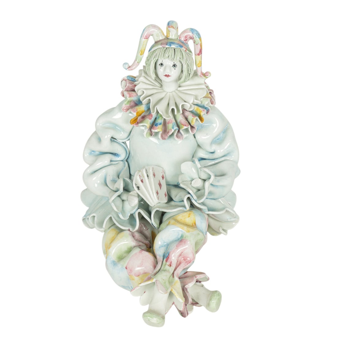 An Italian pottery figure of a clown jester: An Italian pottery figure of a clown jester, marked for Gumps, 7.75"h