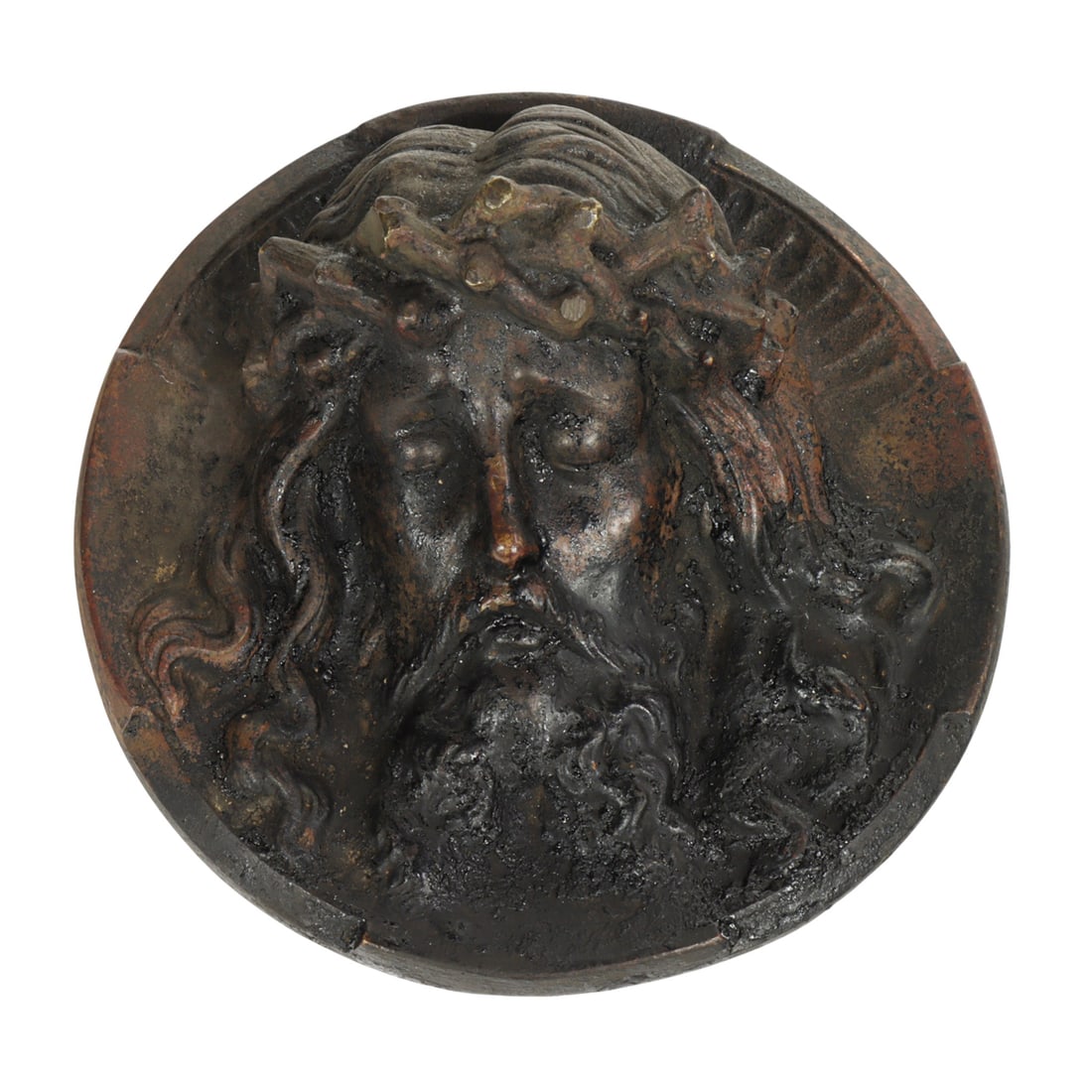 A metal relief medallion of the face of Christ crowned with thorns