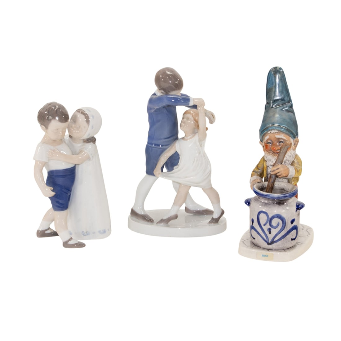 Three Continental porcelain figures: Three Continental porcelain figures, comprising (2) Bing & Grondahl groups of children, marked '1845 JM' or '1614 AO', largest 8"h and a Goebel gnome, marked '1970, WELL 502', 8"h