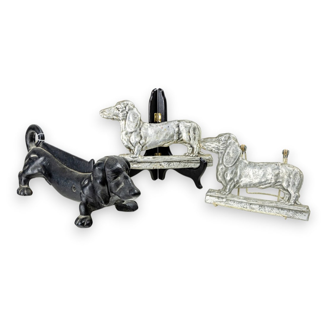 A Dachshund iron boot scraper and a pair of aluminum dog reliefs (1 of 1)