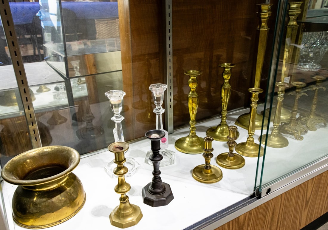 A group of brass candlesticks (1 of 2)