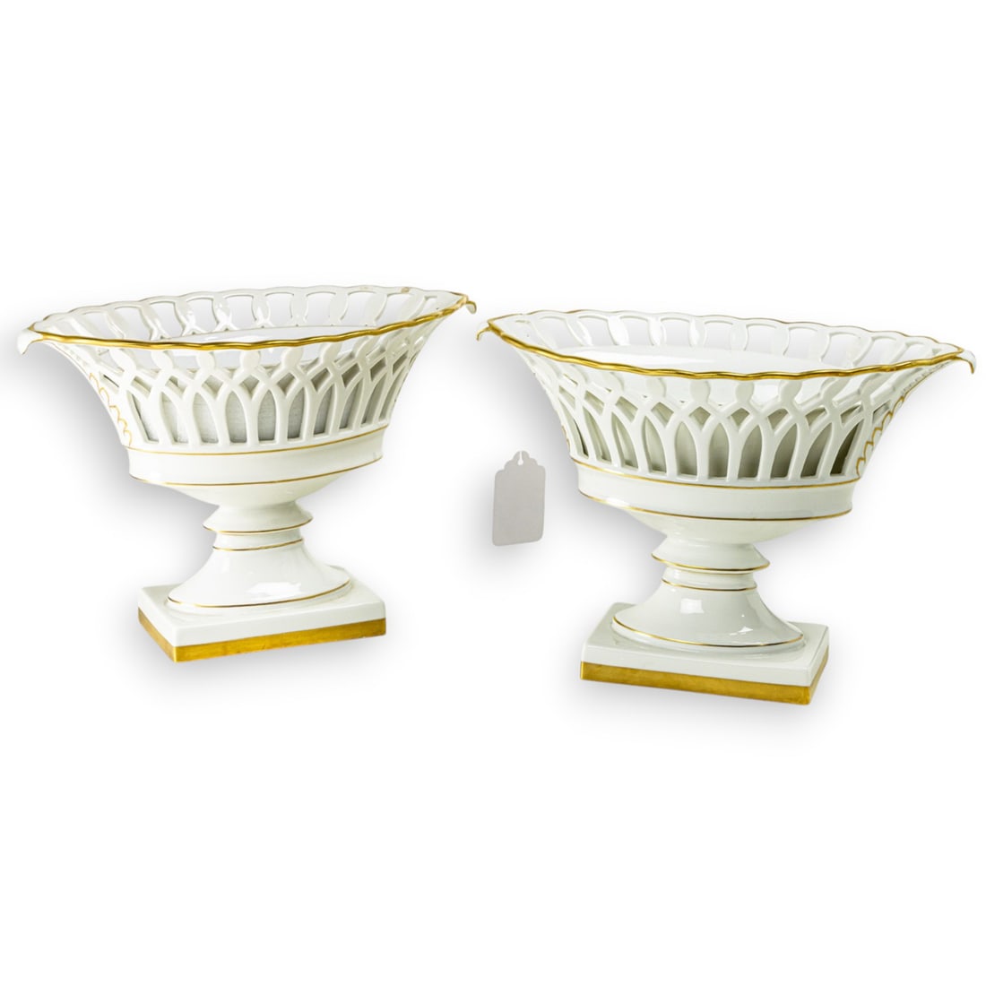 A pair of Vista Allegre porcelain lozenge shaped pedestal baskets in the French taste (1 of 1)