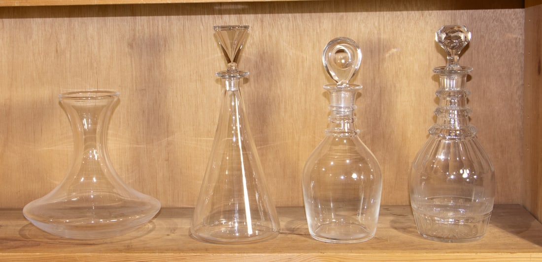 A group of glass decanters: A group of glass decanters, 19th/20th century, including (1) Baccarat ship's decanter; (1) Georgian cut glass triple-ring decanter; (1) triple-ring decanter with bull's eye stopper, 11.75"h and (1)