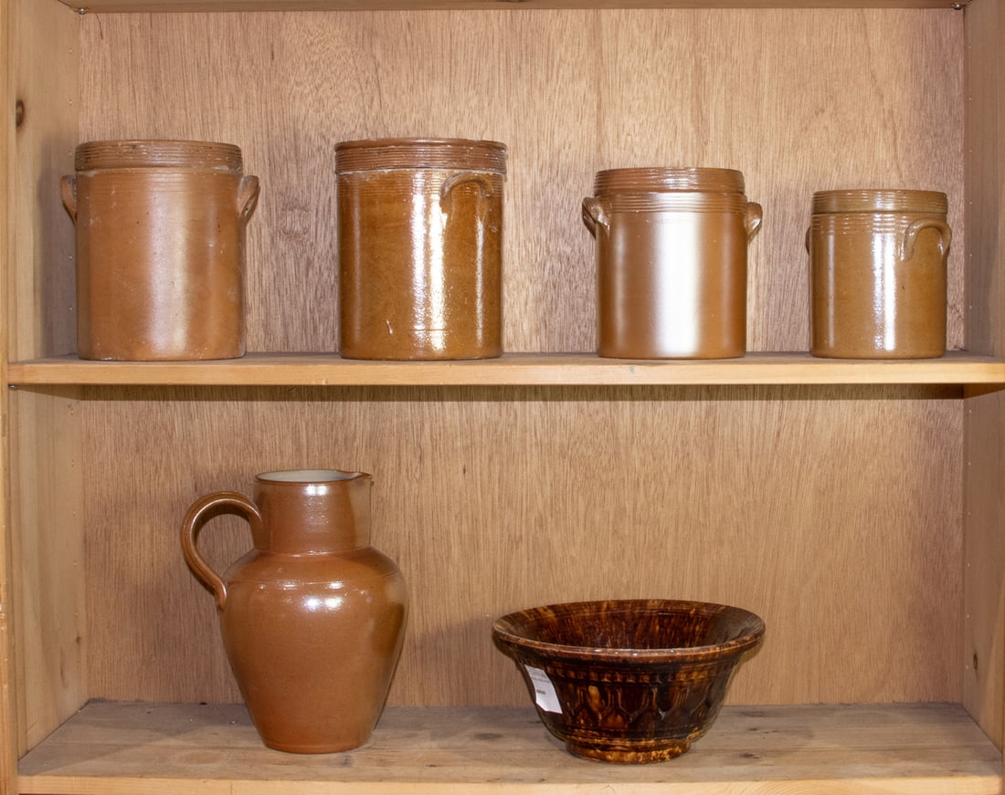 A group of stoneware: A group of stoneware, including four French saltglazed canisters between 6"h and 7.5"h, French saltglazed pitcher 10"h, and tortoiseshell glazed bowl, 10"d [6 total]