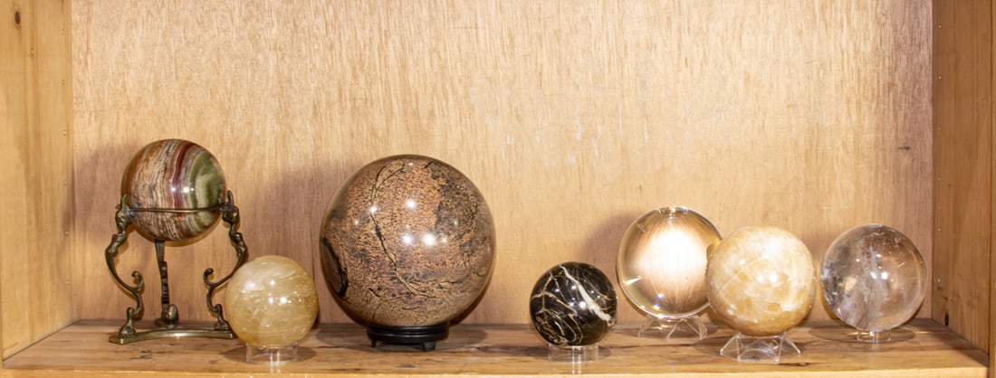 A collection of seven stone and glass spheres (1 of 1)