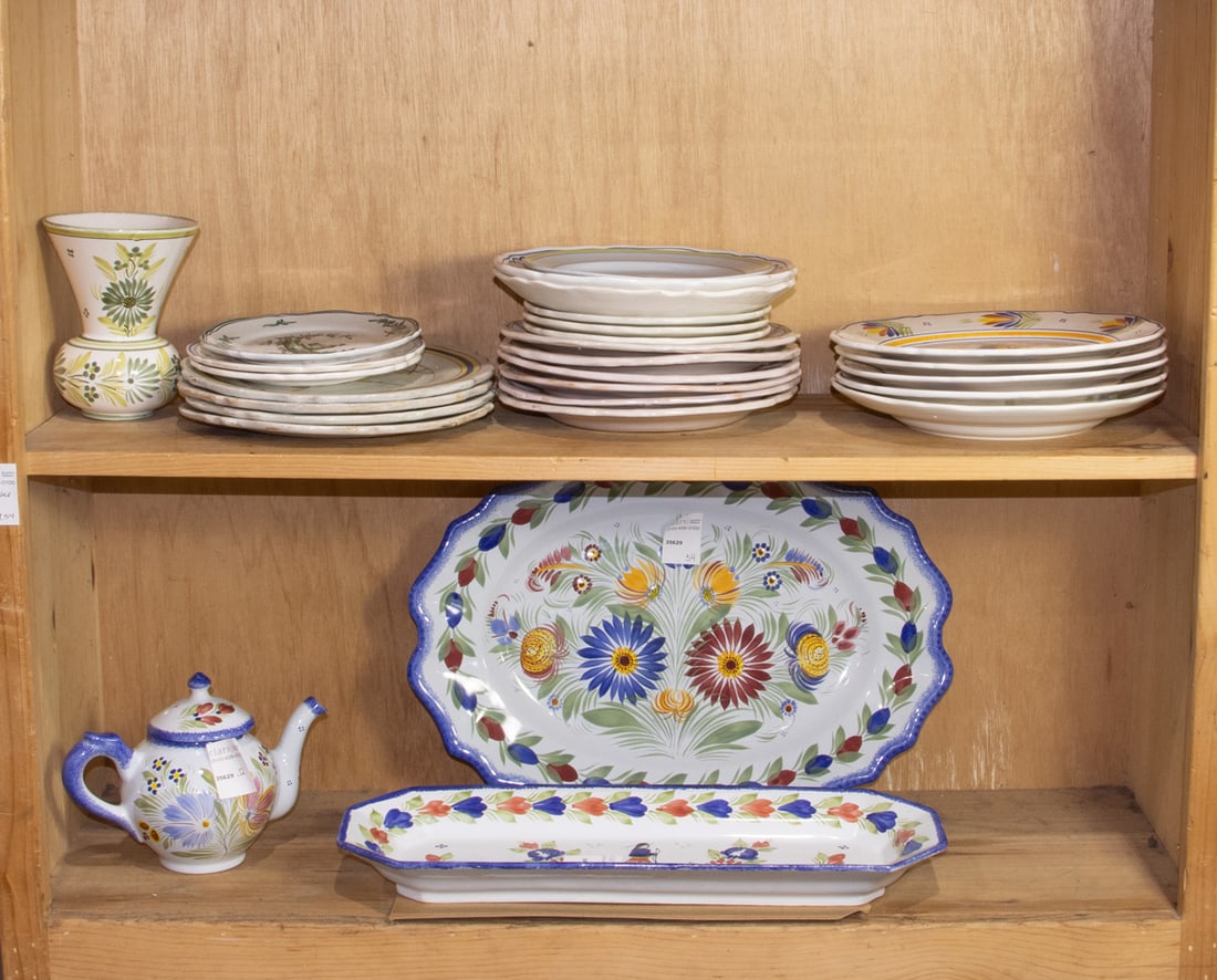 A group of mainly French faience: A group of mainly French faience, including Henriot with folk figures; Moustiers and Martre-Tolosane, plates between 6.5"dia to 10"dida, serving dishes between 17"l x 12"w and 18"l x 7"w [28 total].