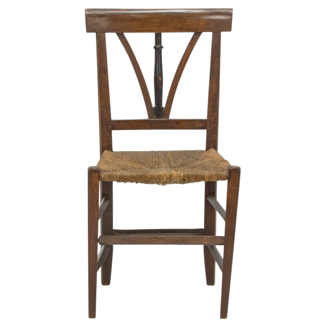 A Provincial partial ebonized side chair: A Provincial partial ebonized side chair, first half 18th century, retains an early rush seat, and rising on square, tapered legs, 36"h x 18"w x 14"d (overall);18.5"h (seat). Property of a private
