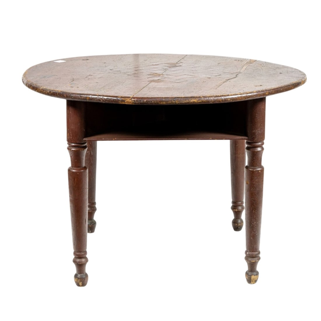 An American tavern game table: An American tavern game table, 19th century, the circular top inset with game board and raised on turned supports, 29"h x 42.5"dia