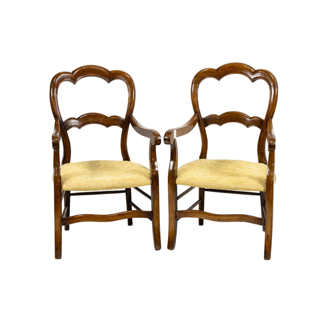 A pair of French Provincial style armchairs: A pair of French Provincial style armchairs, each with scalloped crestrail and scrolled arms, 39"h x 22"w x 24"d (overall); 17"h x 17"d (seat)
