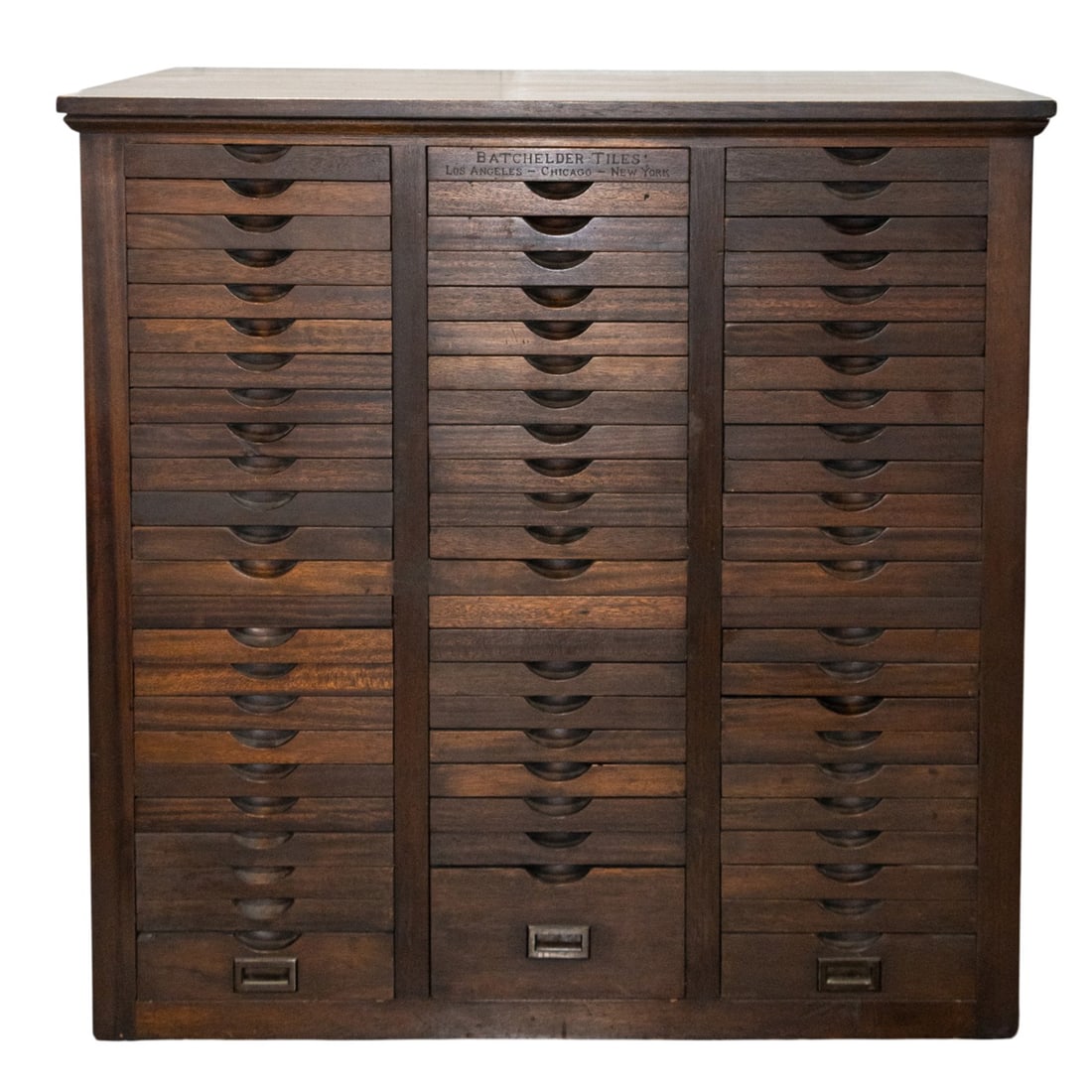 A Batchelder tile sample cabinet