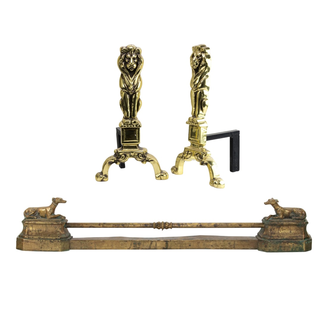 A group of English brass fireplace accessories: A group of English brass fireplace accessories, comprising adjustable fender with recumbent greyhounds, 7"h, adjustable between 40"w and 49"w and a pair of lion form andirons, 16.5"h x 9"w x 7.5"d [3