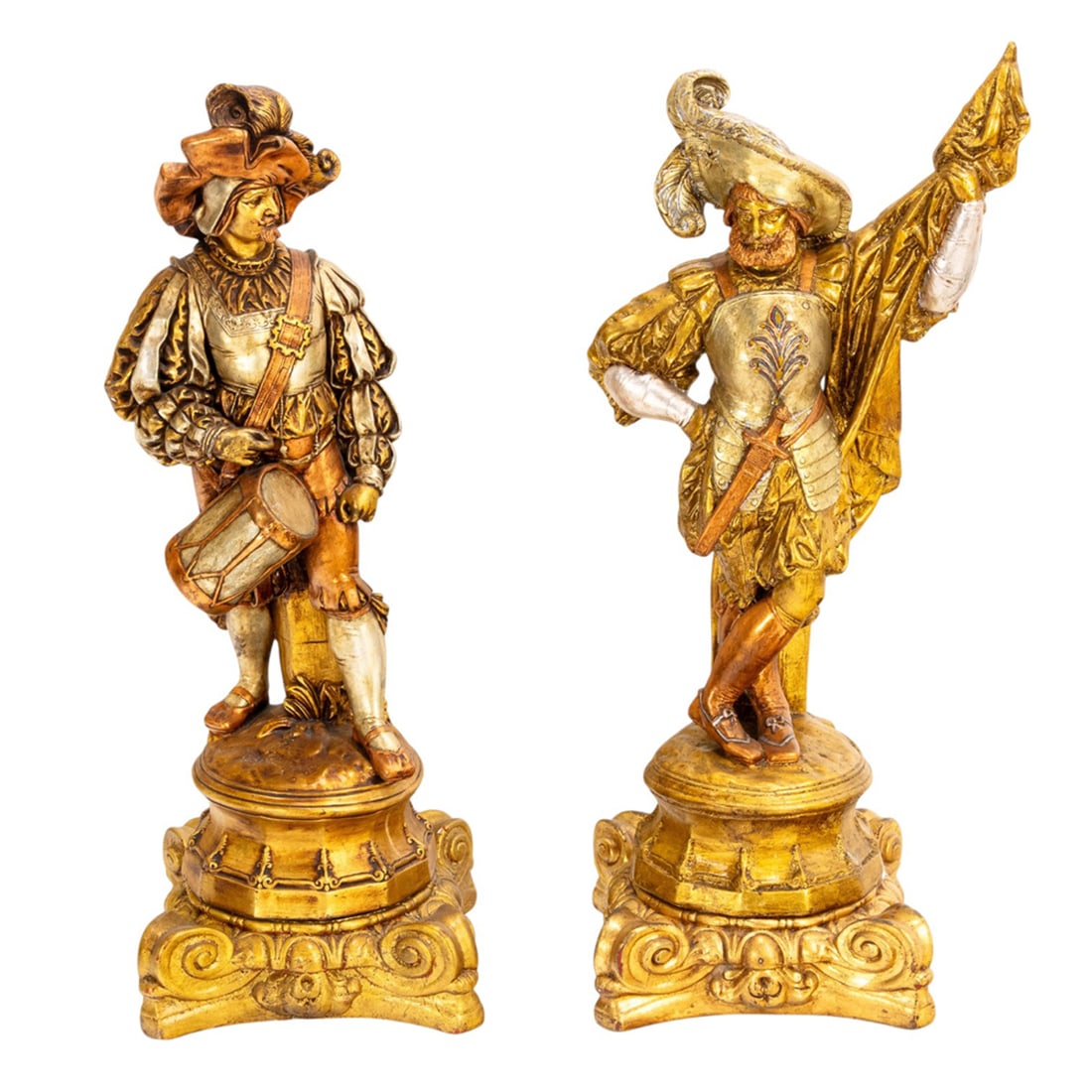 A pair of Renaissance style silvered and gilt plaster figures of cavaliers: A pair of Renaissance style silvered and gilt plaster figures of cavaliers, each raised on scrolled stand, between 39"h x 14"sq and 38"h x 14"sq. Provenance: A private collection, Hillsborough, CA