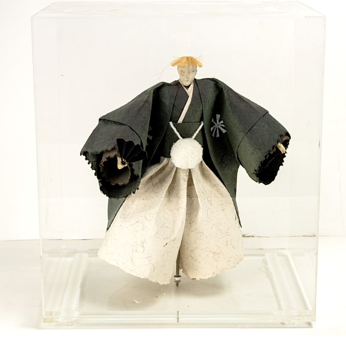 A Japanese paper mache figure of a samurai: A Japanese paper mache figure of a samurai. Mounted in a plexiglas case, 20th century, 13" high.