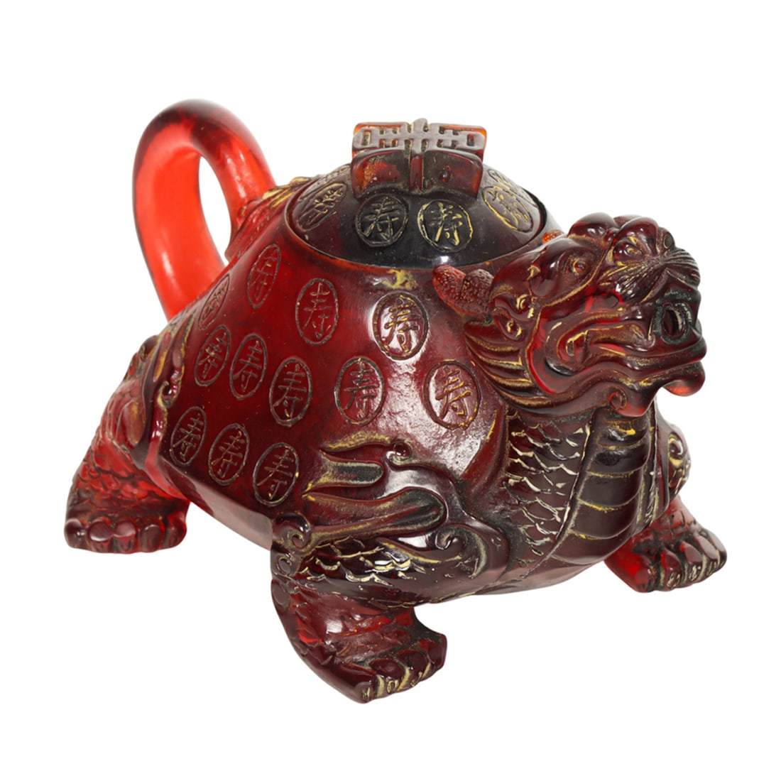 A Chinese amber teapot in the form of a foo lion: A Chinese amber teapot in the form of a foo lion. Featuring Chinese character decoration with a Chinese character knop, with overall gilt highlights and seal mark to underside, 6.125" across. NOTE: