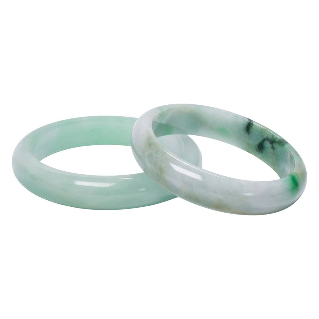 (lot of 2) Chinese green jadeite bangles: (lot of 2) Chinese green jadeite bangles. Form 2.25" to 2.375" inner diameter.