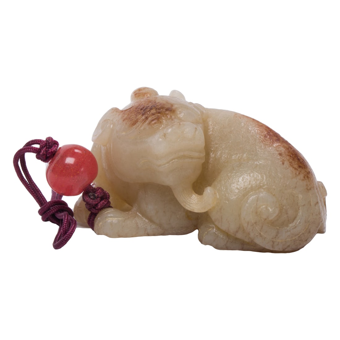 A Chinese russet white jade mythical beast: A Chinese russet white jade mythical beast. 2.375" across.