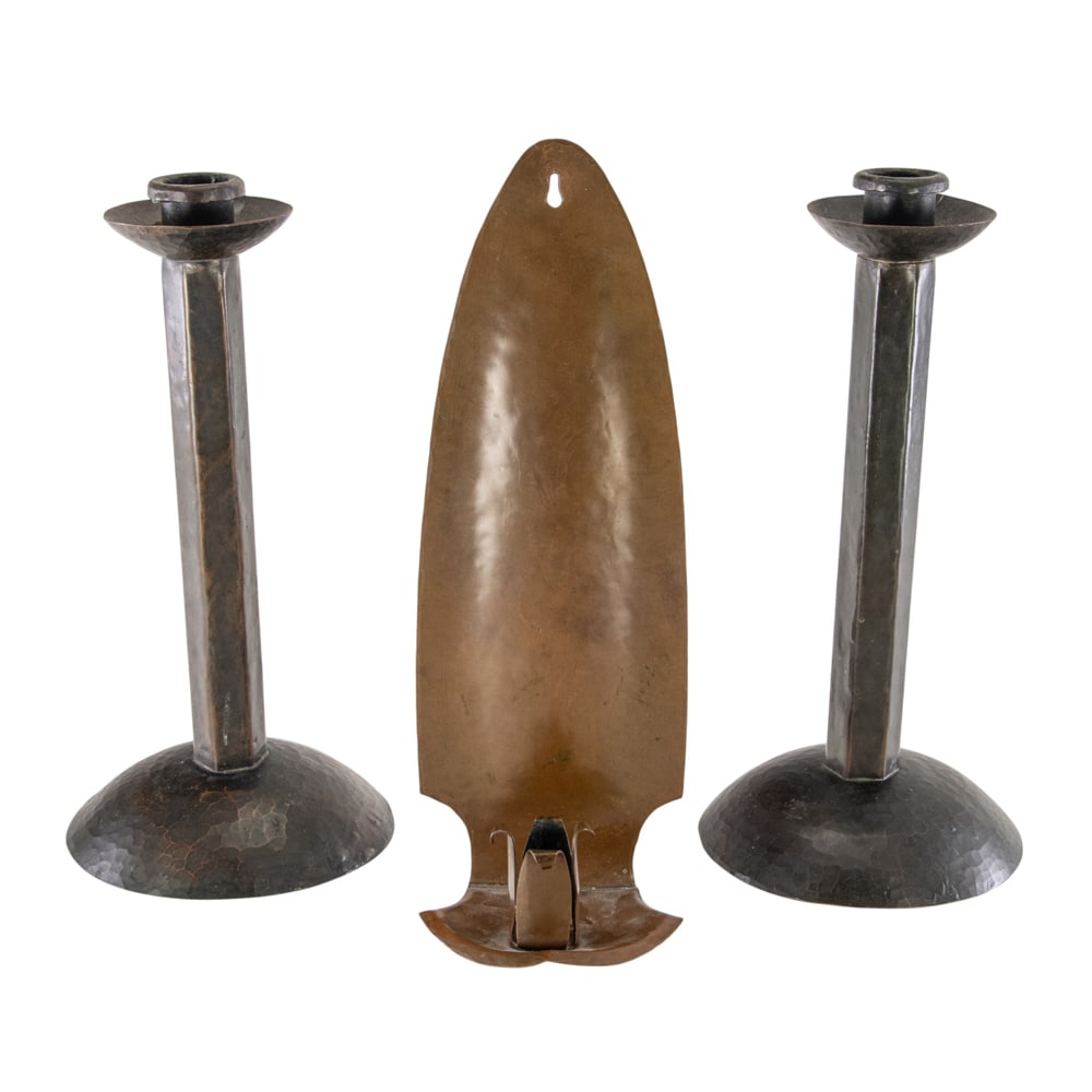 A pair of hammered copper candlesticks and candle sconce (1 of 4)