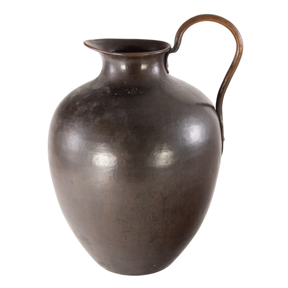A Dirk van Erp hammered copper pitcher: A Dirk van Erp hammered copper pitcher, open windmill mark, 13.5"h