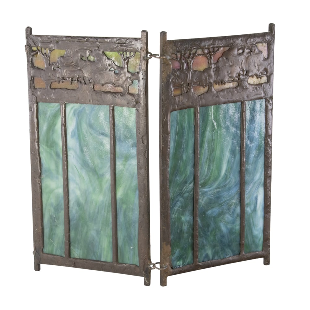 An Arts and Crafts slag glass and copper overlay table screen: An Arts and Crafts slag glass and copper overlay table screen, each panel, 9.25"h x 5"w