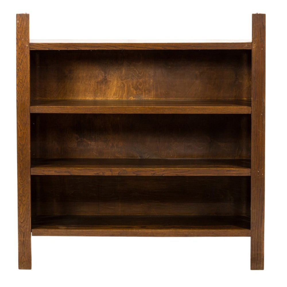 A four tier bookshelf: A four tier bookshelf, with fixed shelves and slatted sides, overall 52"h x 50"w x 13"d