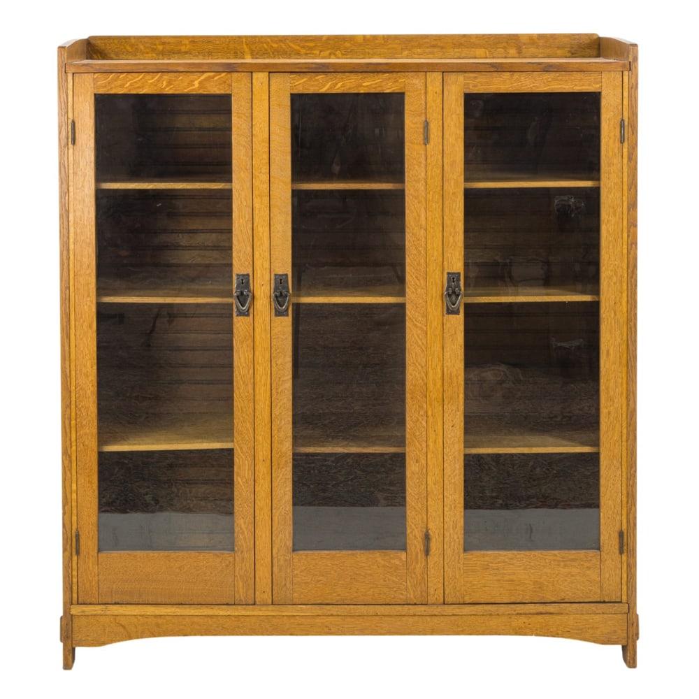 An Arts and Crafts style oak three door bookcase (1 of 6)