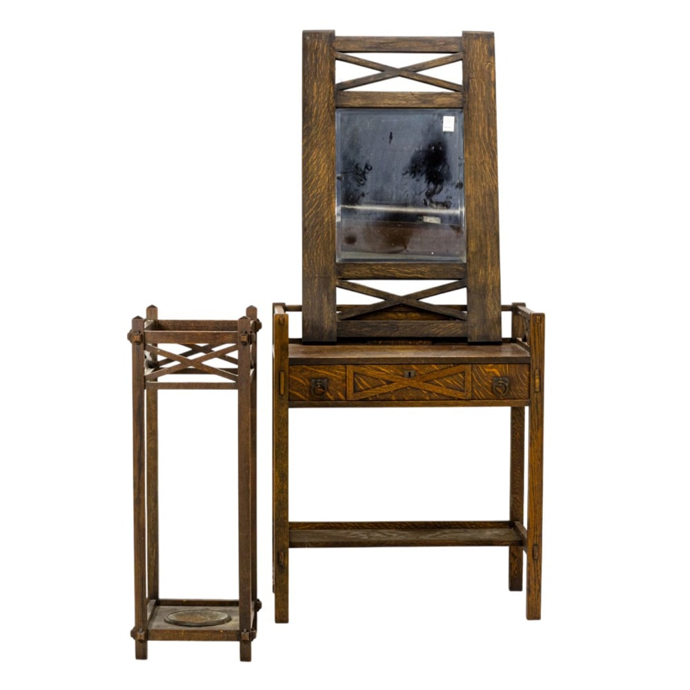 An Arts and Crafts furniture group: An Arts and Crafts furniture group, Grand Rapids 1910, consisting of a mirror, desk, and umbrella stand: mirror 39"h x 24"w; desk/stand 35"h x 30"w x 18"d, umbrella stand 36"h x 16.5"w x 13"d