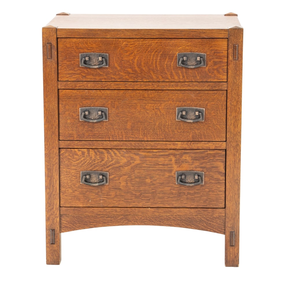 An Arts and Crafts style Stickley Audi side table: An Arts and Crafts style Stickley Audi side table, with three draws and thru tenon construction, retains metal tag and brand in top drawer, 27"h x 22"w x 16"d