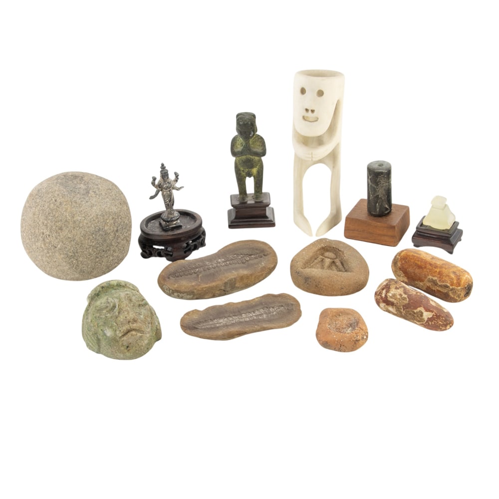 A group of stone: A group of stone, polychrome wood and pottery fragments, including a Meso American serpentine carved pendant, greatest 2" x 2" x 2"