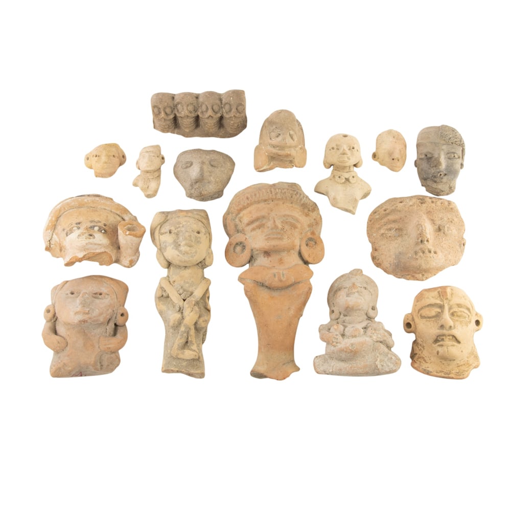 A group of fifteen Pre Columbian and Pre Columbian terra cotta fragments: A group of fifteen Pre Columbian and Pre Columbian terra cotta fragments, including four skulls, figures, and miniature figures, largest 5"h