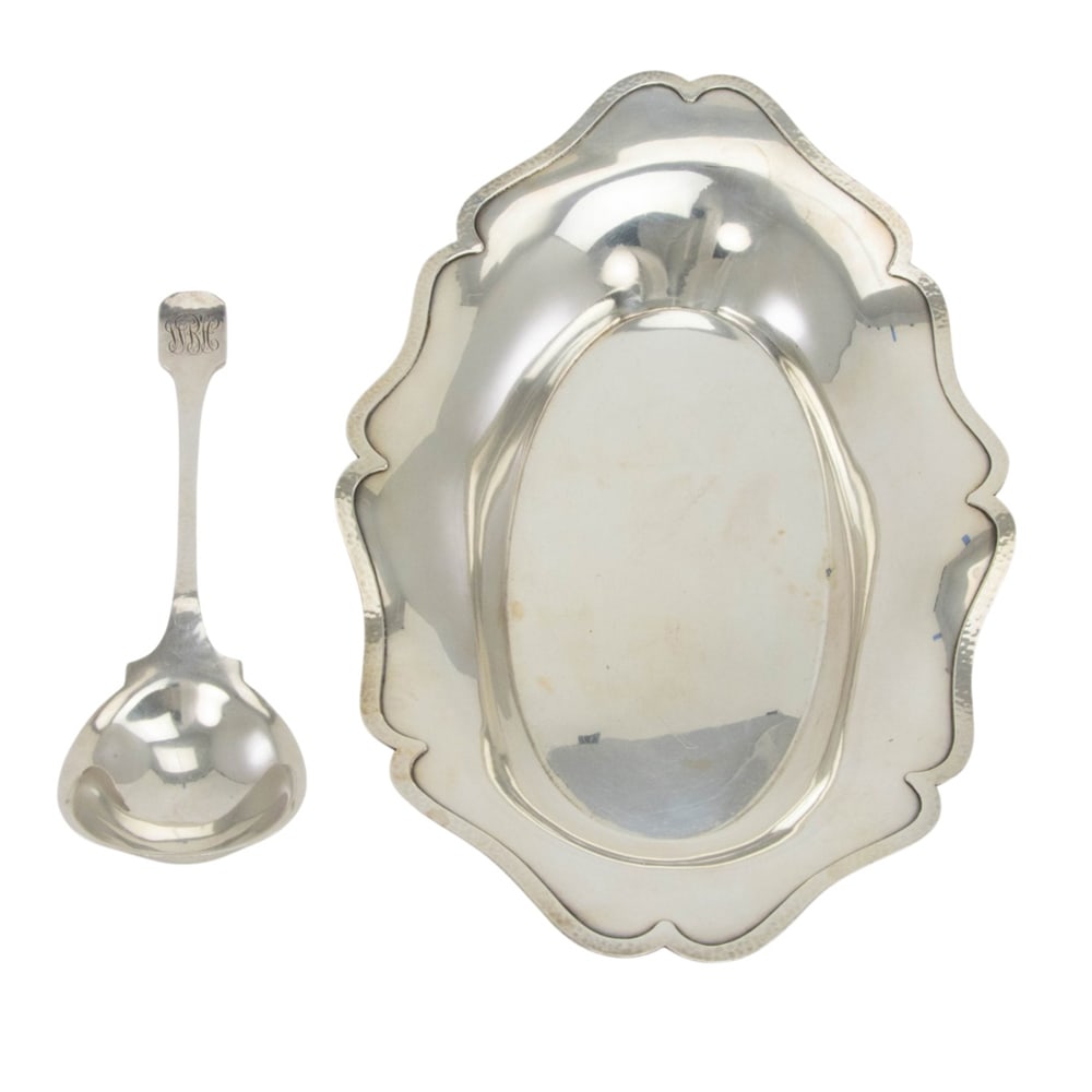 A sterling bread tray, Shreve & Co: A sterling bread tray, Shreve & Co., bell mark, L. 14 1/4 in; together with a large serving spoon by Shreve, Norman Hammered, monogrammed, L. 10 1/4 in. (14.97 oz t.) (2 items)