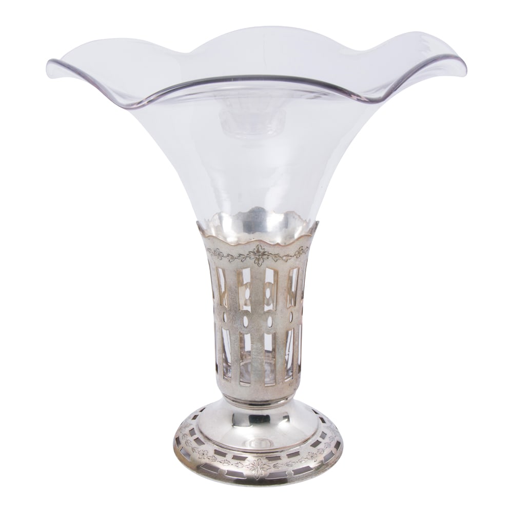 A sterling reticulated vase frame with engraved decoration, Shreve & Co: A sterling reticulated vase frame with engraved decoration, Shreve & Co., bell mark, H. 4 1/2 in. (3.22 oz t.), with clear glass fitting.