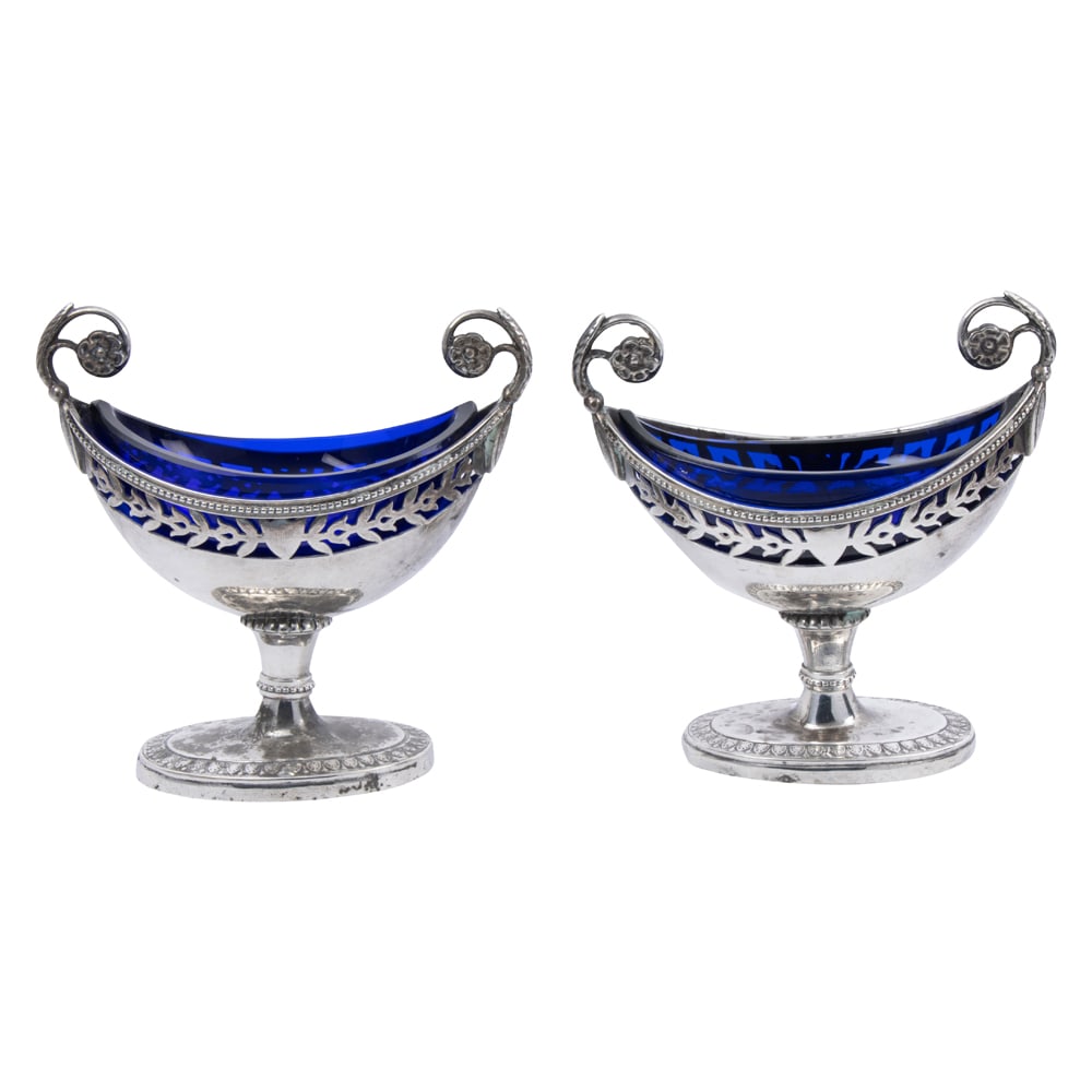 A pair of sterling urn form salt cellars with blue glass liners in the French taste (1 of 3)