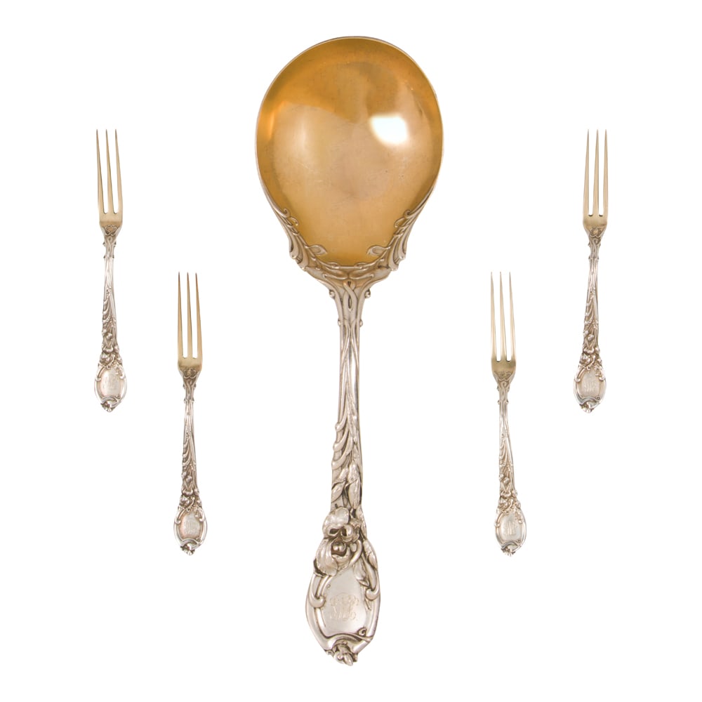 A sterling Art Nouveau flatware group: A sterling Art Nouveau flatware group, Reed & Barton, La Parisienne, monogrammed, comprising: (1) large serving spoon with gilt bowl and (4) berry forks. (7.16 oz t.) [5 total]