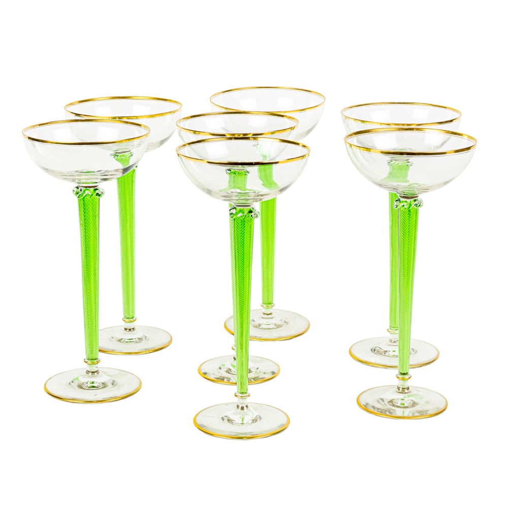 A set of seven tall French hand blown glass saucer champagne: A set of seven tall French hand blown glass saucer champagne, each with a gilt rim bowl above the blown green latticino stem, unsigned 10"h x 4.75"w
