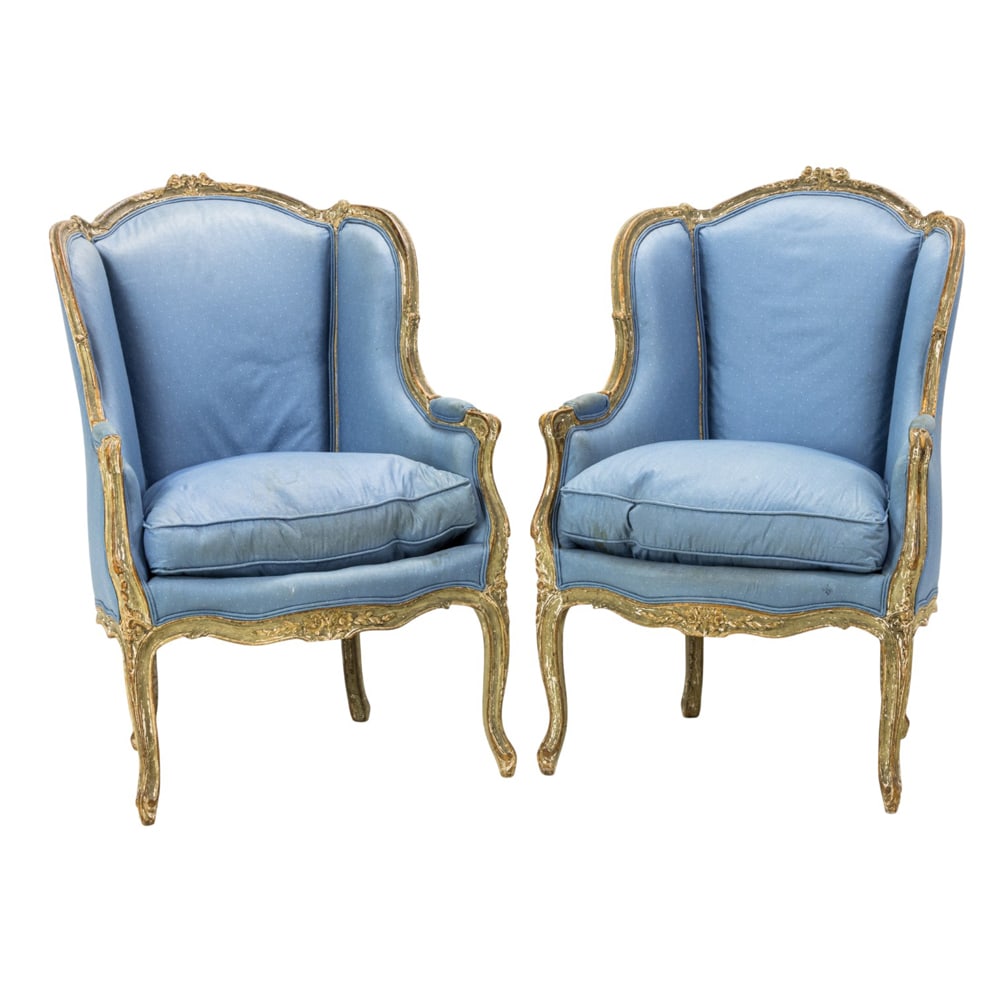 A pair of French bergeres, early 19th century: A pair of French bergeres early 19th century, each retains original paint decorated surface, with drop in cushions, and rising on cabriole legs, 39.5"h x 28"w x 30.5"d (overall); 22.5"h x 21.5"d