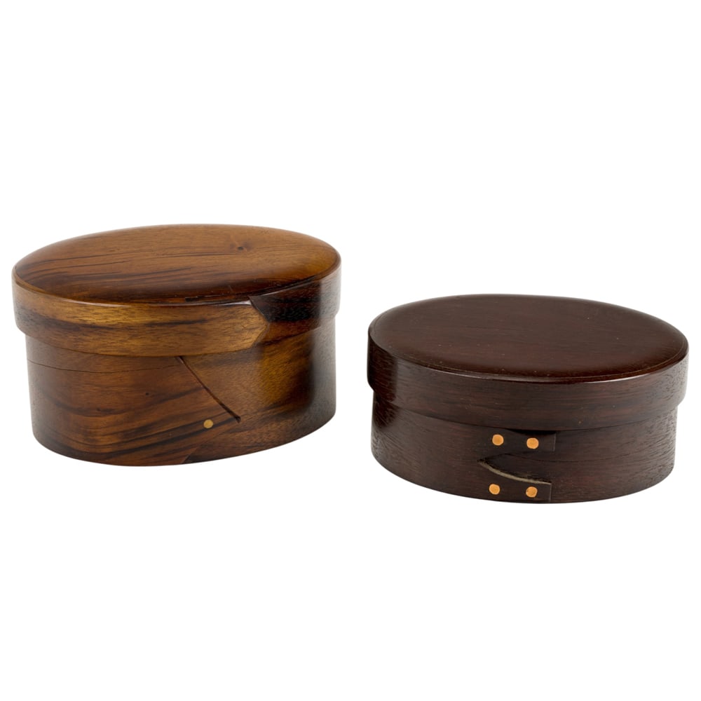 Two Studio steam-bent wood boxes: Two Studio steam-bent wood boxes, E. Koch, circa 1980s, each in the Shaker style and signed, the first 3"h x 7"w x 6"d (smallest); the second dated 1985, 4"h x 7"w x 6"d (largest)