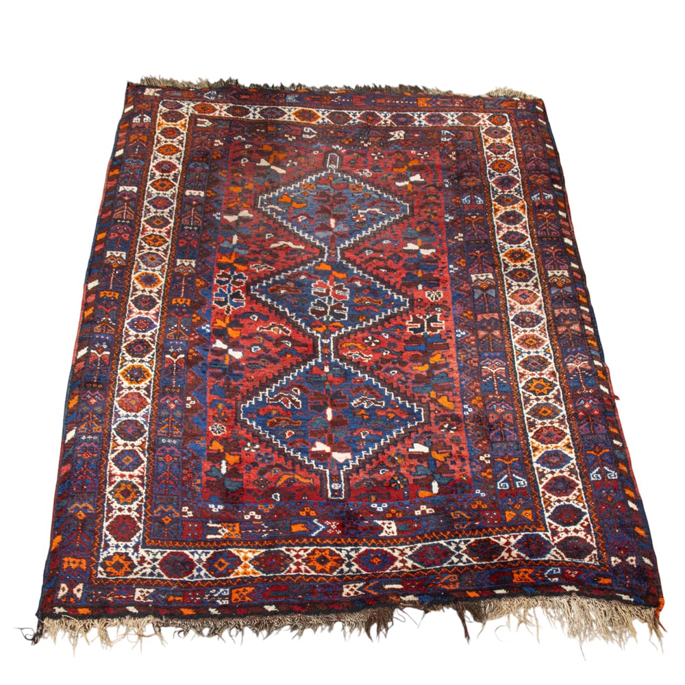 An Afghan carpet: An Afghan carpet, 7'0 x 5'2"