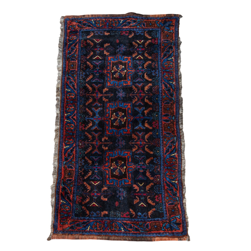 An Afghan carpet: An Afghan carpet, 4'1" x 2'0"