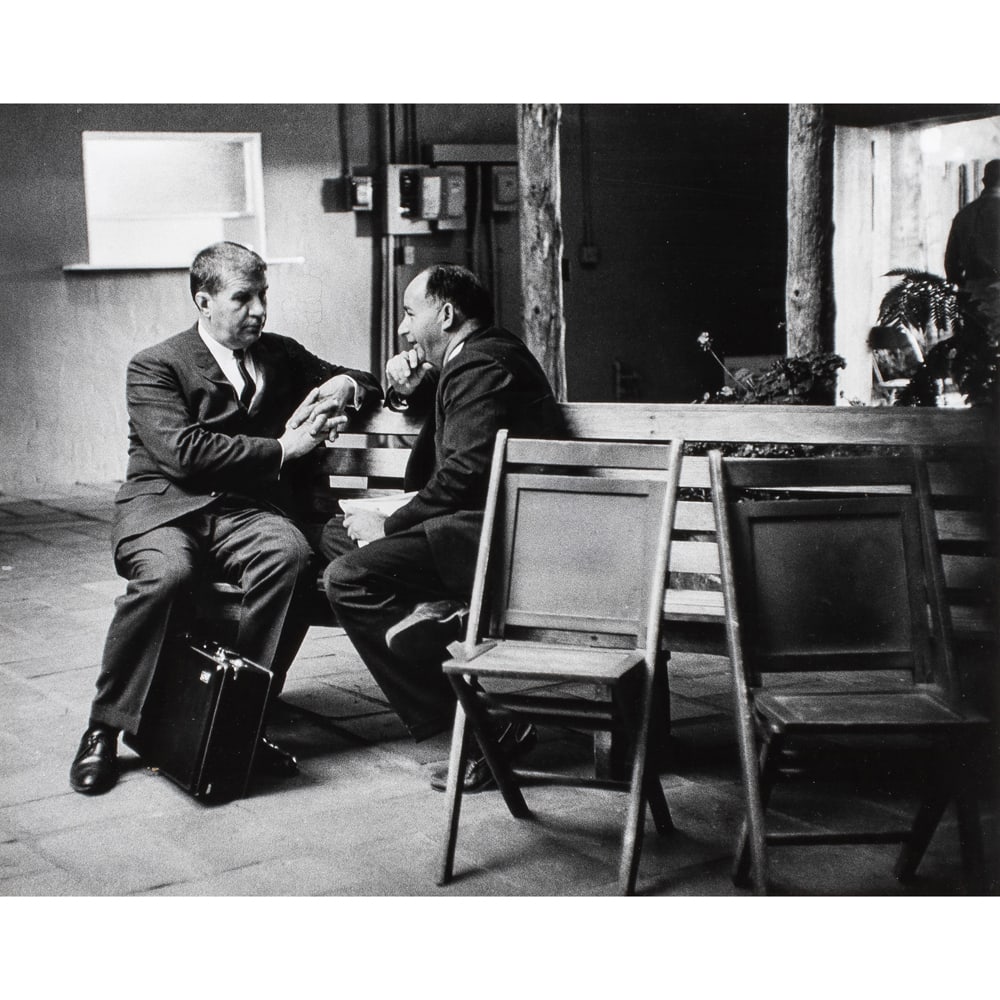 Photograph, Jerry Stoll: Jerry Stoll (American, 1923-2004), Untitled (Two Men in Conversation), gelatin silver print, signed lower right of mat, numbered '2', sight: 15.5"h x 19.5"w, overall (with frame): 24.75"h x 29.5"w
