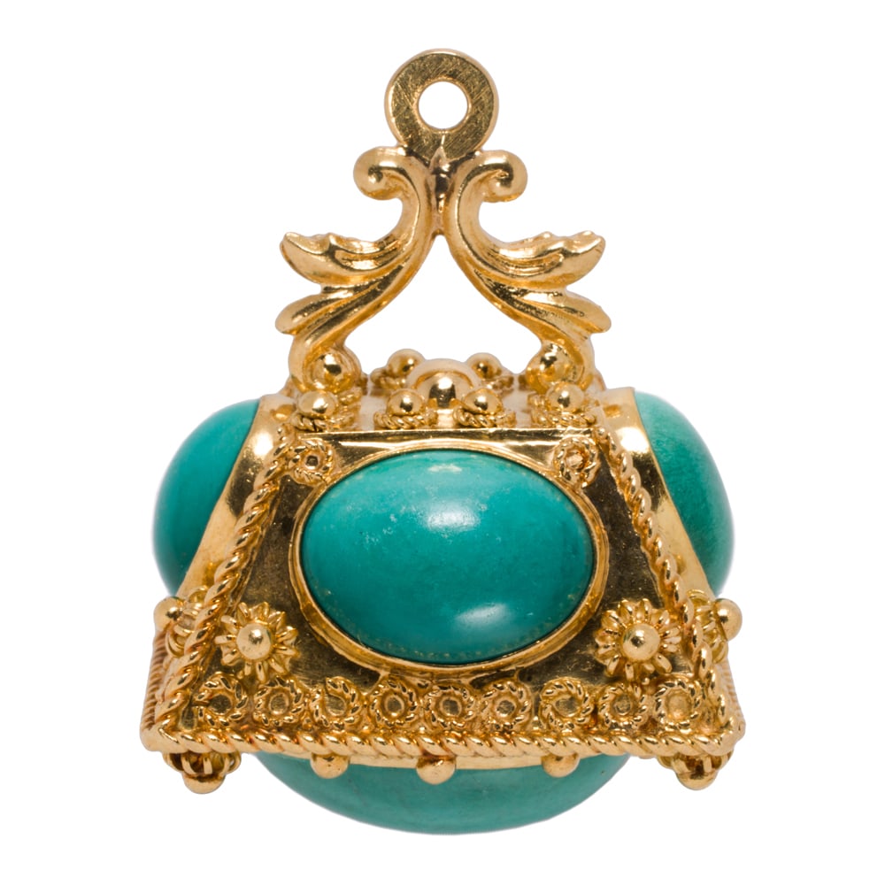 A vintage Etruscan style turquoise and 18k gold charm: A vintage Etruscan style turquoise and 18k gold charm The fob-form charm featuring intricate wire-work and granulation, set with five oval-shaped turquoise cabochons measuring from 9.67 to 17.09 mm lo