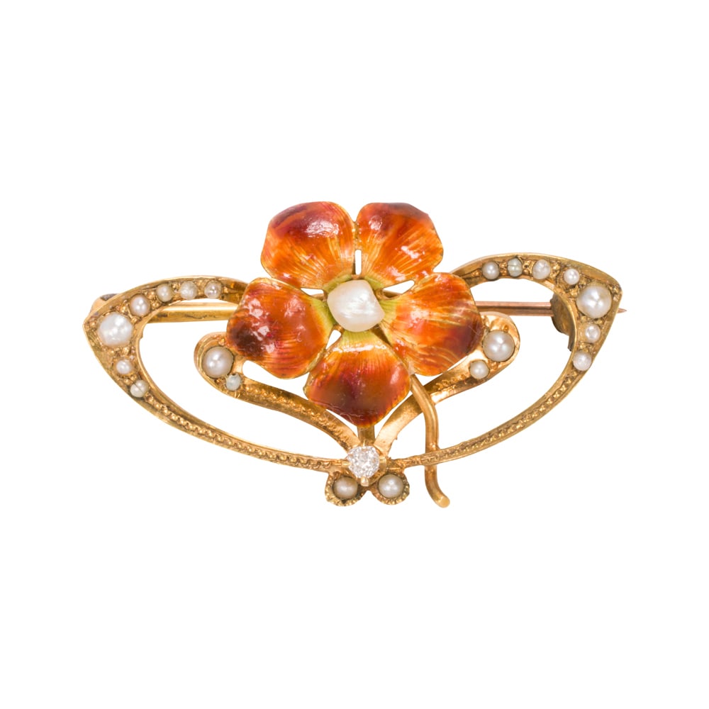 An Art Nouveau enamel, seed pearl, diamond, and 9k gold pin: An Art Nouveau enamel, seed pearl, diamond, and 9k gold pin Of open form design, centering an enameled flower accented by seed pearls and one old mine-cut diamond; width: 1 1/4 in; 2.65 grams