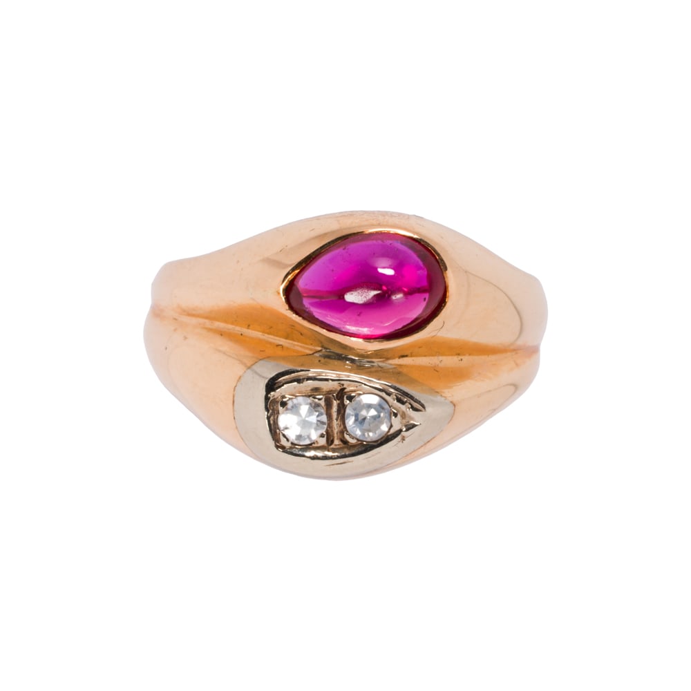 A synthetic ruby, diamond, and 14k gold ring: A synthetic ruby, diamond, and 14k gold ring The vintage style ring set with one pear shaped synthetic ruby cabochon and two round brilliant-cut diamonds; size 8; 5.85 grams