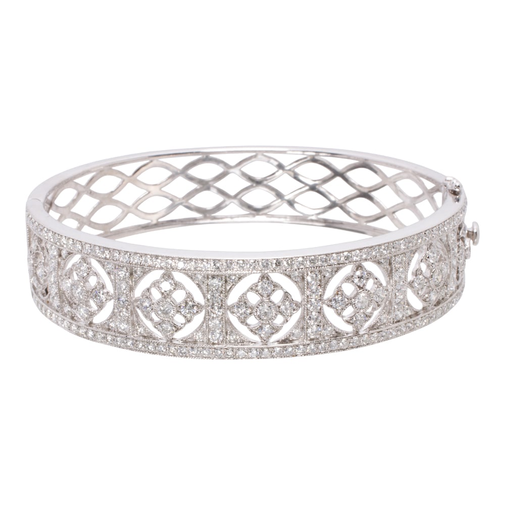 A diamond and 18k white gold bangle bracelet (1 of 2)