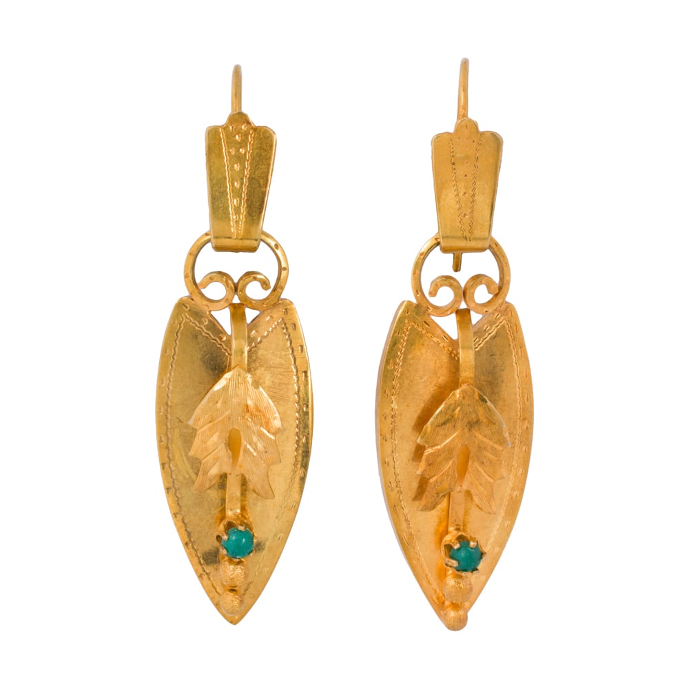 A pair of antique turquoise and 22k gold earrings: A pair of antique turquoise and 22k gold earrings The shield-form earrings set with one round-shaped turquoise cabochon, accented by textured etching; length: 2 in; 6.75 grams