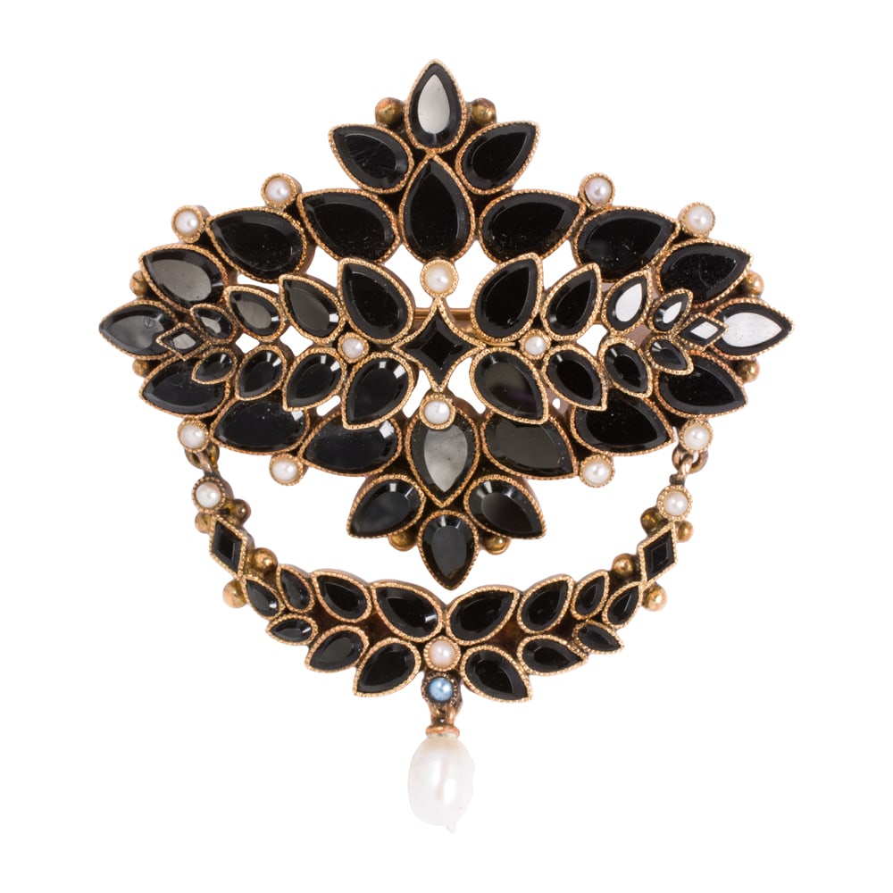 A Victorian style onyx, cultured pearl, and 14k gold pin: A Victorian style onyx, cultured pearl, and 14k gold pin Designed as an arrangement of pear-cut onyx, accented by 16 seed pearls and one baroque cultured pearl; length: 2 in; 11.65 grams