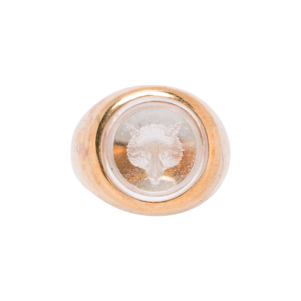 A crystal and 14k gold reverse intaglio ring: A crystal and 14k gold reverse intaglio ring Centering a reverse carved fox intaglio measuring 11.76 mm across; size 4; 8.15 grams